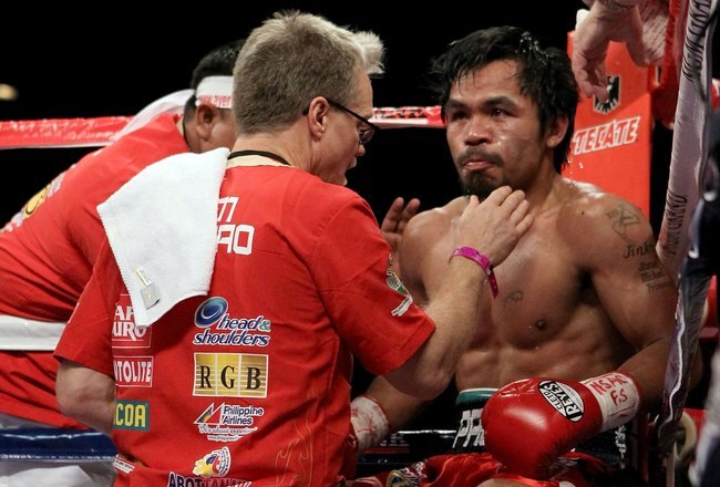LAS VEGAS - NOVEMBER 14:  Manny Pacquiao sits in his corner between rounds with trainer Freddie Roach against Miguel Cotto during their WBO welterweight title fight at the MGM Grand Garden Arena on November 14, 2009 in Las Vegas, Nevada.  (Photo by Al Bello/Getty Images)