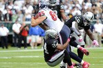 OAKLAND, CA - OCTOBER 3: Tighe End Joel Dreesen #85 of the Houston Texans runs over Michael Huff #24 of the Oakland Raiders into the endzone for a touchdown during an NFL football game October 3, 2010 at The Oakland-Alameda County Coliseum in Oakland, California.  (Photo by Thearon W. Henderson/Getty Images)