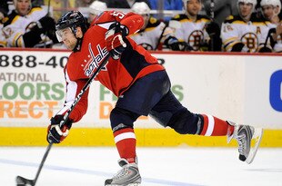 WASHINGTON - APRIL 11:  Mike Green #52 of the Washington Capitals shoots the puck against the Boston Bruins at the Verizon Center on April 11, 2010 in Washington, DC.  (Photo by Greg Fiume/Getty Images)