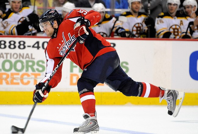 WASHINGTON - APRIL 11:  Mike Green #52 of the Washington Capitals shoots the puck against the Boston Bruins at the Verizon Center on April 11, 2010 in Washington, DC.  (Photo by Greg Fiume/Getty Images)