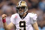 NEW ORLEANS - OCTOBER 03:  Quarterback Drew Brees #9 of the New Orleans Saints celebrates a touchdown in the first quarter against the Carolina Panthers at the Louisiana Superdome on October 3, 2010 in New Orleans, Louisiana.  (Photo by Ronald Martinez/Getty Images)