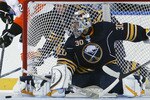BUFFALO - OCTOBER 03:  Ryan Miller #30 of the Buffalo Sabres slides into position as Patrick Maroon #29 of the Philadelphia Flyers passes the puck during their NHL game at HSBC Arena October 3, 2010 in Buffalo, New York.(Photo By Dave Sandford/Getty Images)