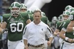 ORLANDO, FL - JANUARY 1: Coach Mark Dantonio of the Michigan State Spartans leads the team to the field for play against the Georgia Bulldogs at the 2009 Capital One Bowl at the Citrus Bowl on January 1, 2009 in Orlando, Florida.  (Photo by Al Messerschmidt/Getty Images)