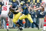ANN ARBOR, MI - NOVEMBER 21: Denard Robinson #16 of the Michigan Wolverines carries the ball during the game against the Ohio State Buckeyes on November 21, 2009 at Michigan Stadium in Ann Arbor, Michigan. Ohio State won the game 21-10. (Photo by Gregory Shamus/Getty Images)