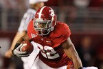 TUSCALOOSA, AL - OCTOBER 02:  Mark Ingram #22 of the Alabama Crimson Tide breaks a tackle by Ahmad Black #35 of the Florida Gators at Bryant-Denny Stadium on October 2, 2010 in Tuscaloosa, Alabama.  (Photo by Kevin C. Cox/Getty Images)