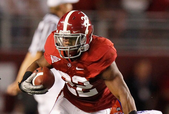 TUSCALOOSA, AL - OCTOBER 02:  Mark Ingram #22 of the Alabama Crimson Tide breaks a tackle by Ahmad Black #35 of the Florida Gators at Bryant-Denny Stadium on October 2, 2010 in Tuscaloosa, Alabama.  (Photo by Kevin C. Cox/Getty Images)