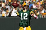 GREEN BAY, WI - OCTOBER 03: Aaron Rodgers #12 of the Green Bay Packers throws a pass against the Detroit Lions at Lambeau Field on October 3, 2010 in Green Bay, Wisconsin. The Packers defeated the Lions 28-26. (Photo by Jonathan Daniel/Getty Images)