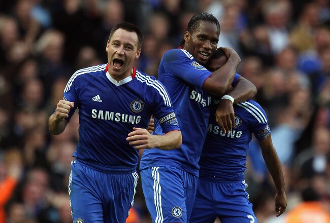 LONDON, ENGLAND - OCTOBER 03:  John Terry, Didier Drogba and Ashley Cole of Chelsea celebrate after team mate Alex scored during the Barclays Premier League match between Chelsea and Arsenal at Stamford Bridge on October 3, 2010 in London, England.  (Photo by Bryn Lennon/Getty Images)