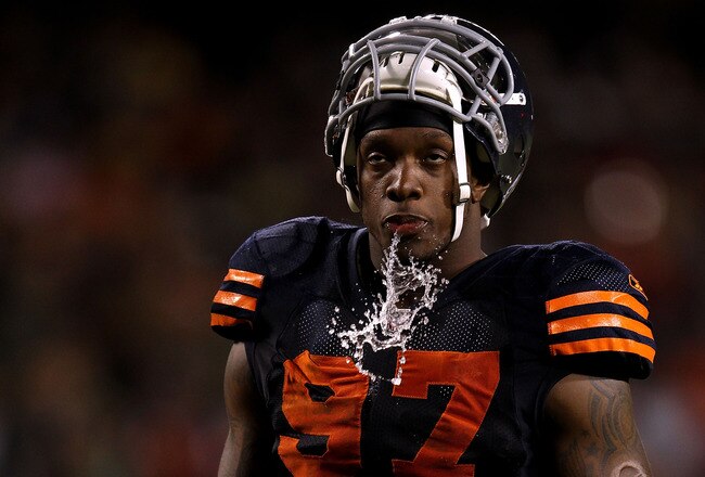 CHICAGO - SEPTEMBER 27:  Mark Anderson #97 of the Chicago Bears spits water out of his mouth against the Green Bay Packers at Soldier Field on September 27, 2010 in Chicago, Illinois.  (Photo by Jonathan Daniel/Getty Images)