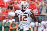 COLUMBUS, OH - SEPTEMBER 11:  Quarterback Jacory Harris #12 of the Miami Hurricanes passes the ball against the Ohio State Buckeyes at Ohio Stadium on September 11, 2010 in Columbus, Ohio.  (Photo by Jamie Sabau/Getty Images)