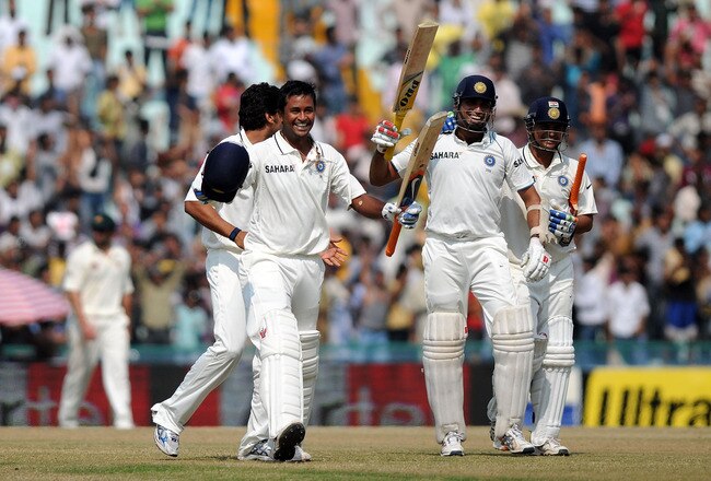 MOHALI, INDIA - OCTOBER 05:   Pragyan Ojha (L) and VVS laxman (2R) and Suresh Raina of India celebrate their win on day five of the First Test match between India and Australia at Punjab Cricket Association Stadium on October 5, 2010 in Mohali, India.  (Photo by Pal Pillai/Getty Images)