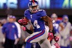 EAST RUTHERFORD, NJ - OCTOBER 03:  Ahmad Bradshaw #44 of the New York Giants runs the ball against the Chicago Bears at New Meadowlands Stadium on October 3, 2010 in East Rutherford, New Jersey.  (Photo by Michael Heiman/Getty Images)