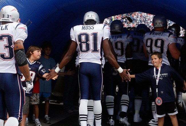 FOXBORO, MA - SEPTEMBER 12: Randy Moss #81 of the New England Patriots enters the field before the NFL season opener against the Cincinnati Bengals at Gillette Stadium on September 12, 2010 in Foxboro, Massachusetts. (Photo by Jim Rogash/Getty Images)