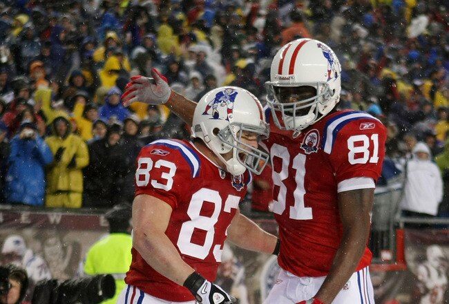 FOXBORO, MA - OCTOBER 18:  Wes Welker #83 of the New England Patriots is congratulated by teammate Randy Moss #81 after Welker scored a touchdown in the second quarter against the Tennessee Titans on October 18, 2009 at Gillette Stadium in Foxboro, Massachusetts.  (Photo by Elsa/Getty Images)