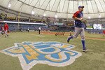 ST. PETERSBURG - OCTOBER 06:  The Texas Rangers warm-up before Game 1 of the ALDS against the Tampa Bay Rays at Tropicana Field on October 6, 2010 in St. Petersburg, Florida.  (Photo by Mike Ehrmann/Getty Images)