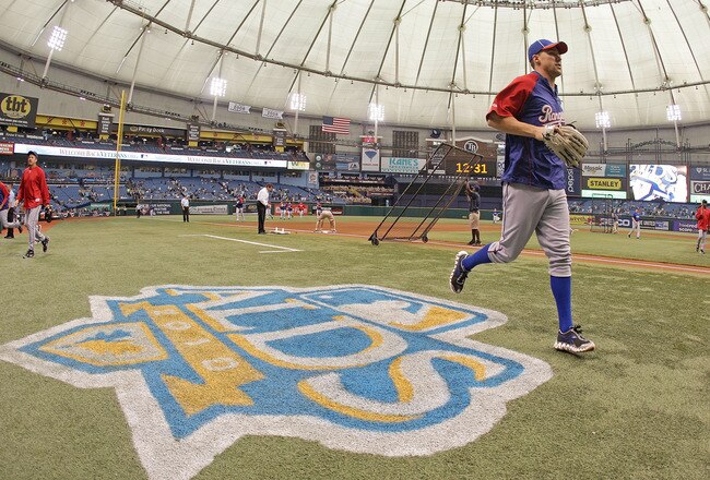 ST. PETERSBURG - OCTOBER 06:  The Texas Rangers warm-up before Game 1 of the ALDS against the Tampa Bay Rays at Tropicana Field on October 6, 2010 in St. Petersburg, Florida.  (Photo by Mike Ehrmann/Getty Images)