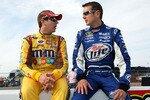 DARLINGTON, SC - MAY 08:  Kyle Busch (L), driver of the #18 M&M's Toyota, talks with his brother Kurt Busch, driver of the #2 Miller Lite Dodge, during qualifying for the NASCAR Sprint Cup Series Southern 500 on May 8, 2009 at Darlington Raceway in Darlington, South Carolina.  (Photo by Chris Trotman/Getty Images)