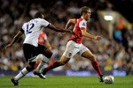 LONDON, ENGLAND - SEPTEMBER 21:  Jack Wilshere of Arsenal goes past the challenge from Wilson Palacios of Spurs during the Carling Cup third round match between Tottenham Hotspur and Arsenal at White Hart Lane on September 21, 2010 in London, England.  (Photo by Michael Regan/Getty Images)