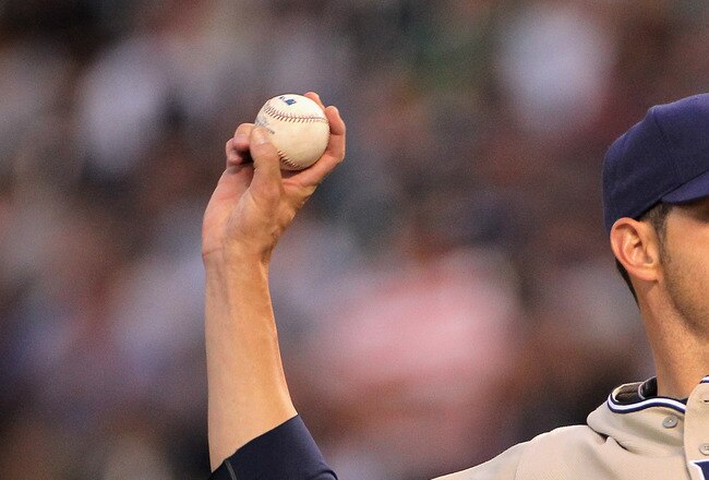 DENVER - SEPTEMBER 14:  Starting pitcher Jon Garland #27 of the San Diego Padres delivers against the Colorado Rockies at Coors Field on September 14, 2010 in Denver, Colorado.  (Photo by Doug Pensinger/Getty Images)
