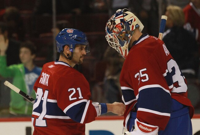 MONTREAL, QC - SEPTEMBER 26: Brian Gionta #21 of the Montreal Canadiens congratulates Alex Auld #35 on his win over the Minnesota Wild at the Bell Centre on September 26, 2010 in Montreal, Canada.  The Canadiens defeated the Wild 4-3. (Photo by Bruce Bennett/Getty Images)