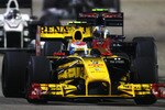 SINGAPORE - SEPTEMBER 26:  Vitaly Petrov of Russia and Renault drives during the Singapore Formula One Grand Prix at the Marina Bay Street Circuit on September 26, 2010 in Singapore.  (Photo by Paul Gilham/Getty Images)