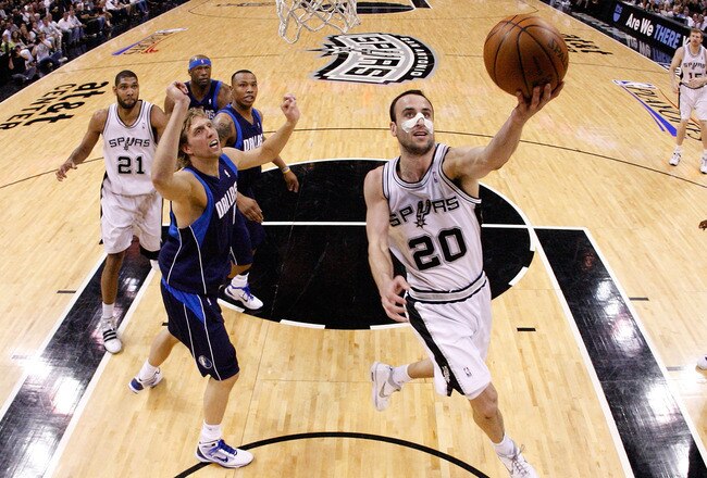 SAN ANTONIO - APRIL 29:  Guard Manu Ginobili #20 of the San Antonio Spurs takes a shot against Dirk Nowitzki #41 of the Dallas Mavericks in Game Six of the Western Conference Quarterfinals during the 2010 NBA Playoffs at AT&T Center on April 29, 2010 in San Antonio, Texas. NOTE TO USER: User expressly acknowledges and agrees that, by downloading and or using this photograph, User is consenting to the terms and conditions of the Getty Images License Agreement.  (Photo by Ronald Martinez/Getty Images)