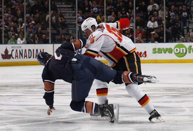 EDMONTON, CANADA - OCTOBER 1:  James Vandermeer #2 of the Edmonton Oilers fights Tim Jackman #15 of the Calgary Flames in second-period action at Rexall Place October 1, 2010 in Edmonton, Alberta, Canada. (Photo by Dale MacMillan/Getty Images)