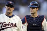 MINNEAPOLIS, MN - OCTOBER 7: Starting pitcher Carl Pavano #48 and catcher Joe Mauer #7 of the Minnesota Twins walk to the dugout prior to game two of the ALDS game against the New York Yankees on October 7, 2010 at Target Field in Minneapolis, Minnesota.  (Photo by Hannah Foslien/Getty Images)
