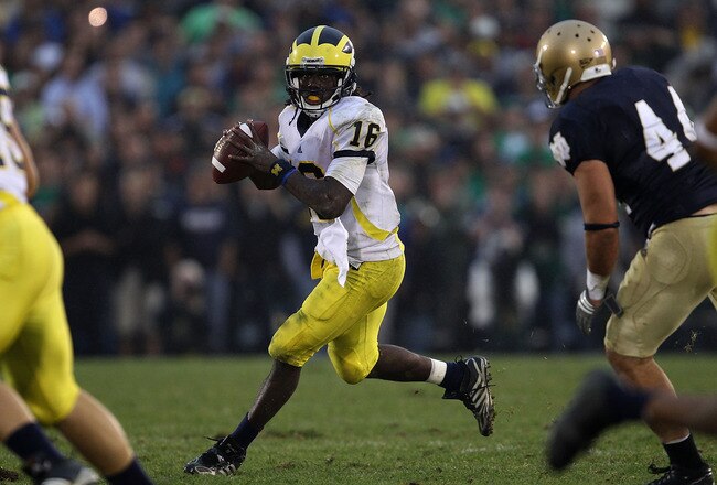 SOUTH BEND, IN - SEPTEMBER 11: Denard Robinson #16 of the Michigan Wolverines looks for a receiver under pressure from Carlo Calabrese #44 of the Notre Dame Fighting Irish at Notre Dame Stadium on September 11, 2010 in South Bend, Indiana. Michigan defeated Notre Dame 28-24. (Photo by Jonathan Daniel/Getty Images)