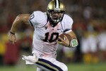 LOS ANGELES, CA - OCTOBER 02:  Quarterback Jake Locker #10 of the Washington Huskies carries the ball against the USC Trojans at the Los Angeles Memorial Coliseum on October 2, 2010 in Los Angeles, California.  Washington won 32-31.  (Photo by Stephen Dunn/Getty Images)