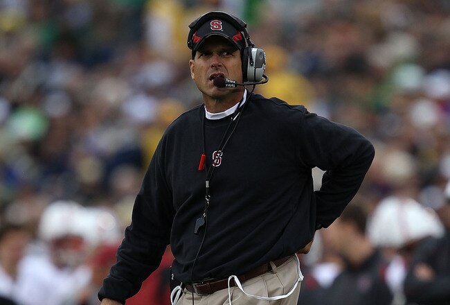 SOUTH BEND, IN - SEPTEMBER 25: Head coach Jim Harbaugh of the Stanford Cardinal looks at the scoreboard during a time out against the Notre Dame Fighting Irish at Notre Dame Stadium on September 25, 2010 in South Bend, Indiana. Stanford defeated Notre Dame 37-14. (Photo by Jonathan Daniel/Getty Images)