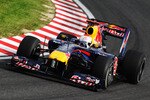 SUZUKA, JAPAN - OCTOBER 08:  Sebastian Vettel of Germany and Red Bull Racing drives during practice for the Japanese Formula One Grand Prix at Suzuka Circuit on October 8, 2010 in Suzuka, Japan.  (Photo by Mark Thompson/Getty Images)