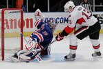 NEW YORK - OCTOBER 01: Goalkeeper Henrik Lundqvist #30 of the New York Rangers makes the winning save on a shot from Peter Regin #13 of the Ottawa Senators during their preseason game on October 1, 2010 at Madison Square Garden in New York City.  (Photo by Chris McGrath/Getty Images)