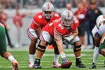 COLUMBUS, OH - SEPTEMBER 11:  Center Michael Brewster #50 of the Ohio State Buckeyes snaps the ball to quarterback Terrelle Pryor #2 of the Ohio State Buckeyes against the Miami Hurricanes at Ohio Stadium on September 11, 2010 in Columbus, Ohio.  (Photo by Jamie Sabau/Getty Images)
