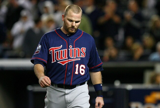 NEW YORK - OCTOBER 09:  Jason Kubel #16 of the Minnesota Twins reacts as he walsk back to the dugout after he struck out in the top of the sixth inning against the New York Yankees  during Game Three of the ALDS part of the 2010 MLB Playoffs at Yankee Stadium on October 9, 2010 in the Bronx borough of New York City.  (Photo by Andrew Burton/Getty Images)