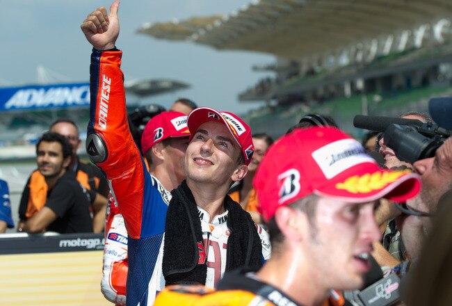 KUALA LUMPUR, MALAYSIA - OCTOBER 09:  Jorge Lorenzo of Spain and Fiat Yamaha Team celebrates the pole position at the end of the qualifying practice of MotoGP of Malaysia at Sepang International Circuit on October 9, 2010 in Kuala Lumpur, Malaysia.  (Photo by Mirco Lazzari gp/Getty Images)