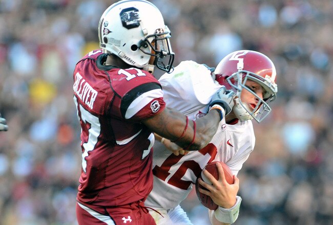 COLUMBIA, SC - OCTOBER 9: Defensive back Chris Culliver #17 of the Carolina Gamecocks tackles quarterback Greg McElroy of the Alabama Crimson Tide October 9, 2010 at Williams-Brice Stadium in Columbia, South Carolina.  (Photo by Al Messerschmidt/Getty Images)