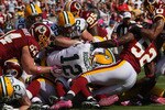 LANDOVER, MD - OCTOBER 10:  Members of the Washington Redskins defense stop Green Bay Packers quarterback Aaron Rodgers #12 on third down and goal at FedExField on October 10, 2010 in Landover, Maryland.  (Photo by Win McNamee/Getty Images)