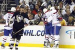 PITTSBURGH - OCTOBER 9:  Scott Gomez #11 of the Montreal Canadiens celebrates his game winning goal with teammates against the Pittsburgh Penguins at Consol Energy Center on October 9, 2010 in Pittsburgh, Pennsylvania.  The Canadiens defeated the Penguins 3-2.  (Photo by Justin K. Aller/Getty Images)