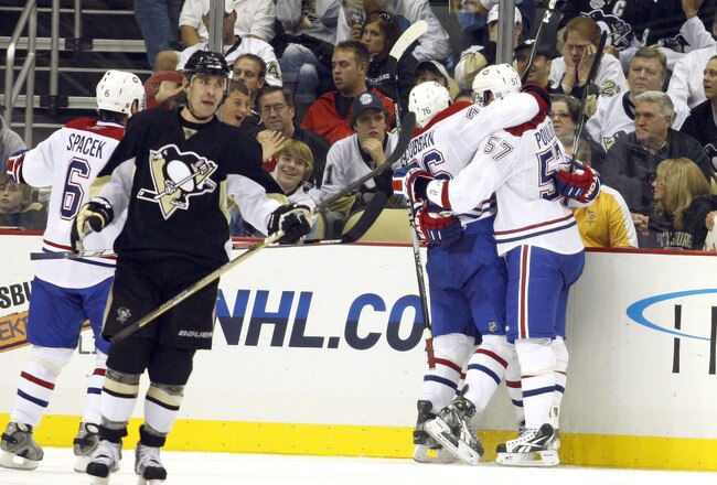 PITTSBURGH - OCTOBER 9:  Scott Gomez #11 of the Montreal Canadiens celebrates his game winning goal with teammates against the Pittsburgh Penguins at Consol Energy Center on October 9, 2010 in Pittsburgh, Pennsylvania.  The Canadiens defeated the Penguins 3-2.  (Photo by Justin K. Aller/Getty Images)