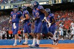 BOISE, ID - SEPTEMBER 25:  Quarterback Kellen Moore #11 and the Boise State Broncos celebrates a touchdown against the Oregon Stage Beavers at Bronco Stadium on September 25, 2010 in Boise, Idaho.  (Photo by Otto Kitsinger III/Getty Images)