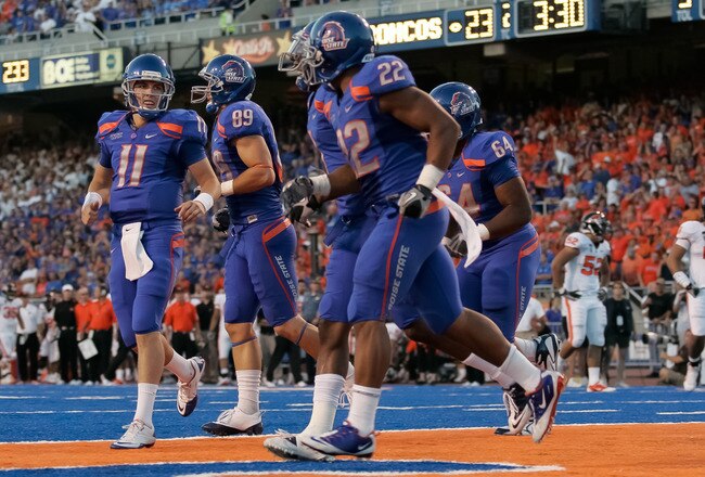 BOISE, ID - SEPTEMBER 25:  Quarterback Kellen Moore #11 and the Boise State Broncos celebrates a touchdown against the Oregon Stage Beavers at Bronco Stadium on September 25, 2010 in Boise, Idaho.  (Photo by Otto Kitsinger III/Getty Images)