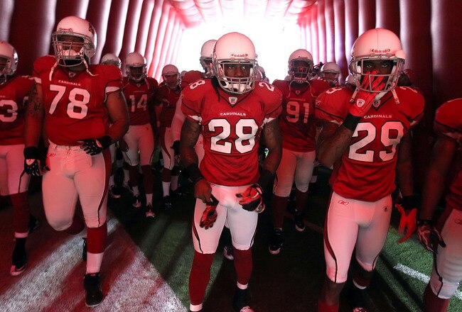 GLENDALE, AZ - SEPTEMBER 26:  (L-R) Alan Branch #78, Greg Toler #28 and Dominique Rodgers-Cromartie #29 of the Arizona Cardinals waits to be introduced before the NFL game against the Oakland Raiders at the University of Phoenix Stadium on September 26, 2010 in Glendale, Arizona.  The Cardinals defeated the Raiders 24-23.  (Photo by Christian Petersen/Getty Images)