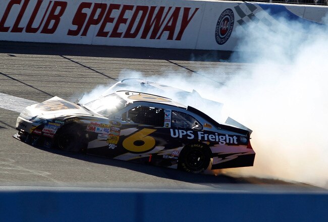 FONTANA, CA - OCTOBER 10:  David Ragan, driver of the #6 UPS Ford, and Kurt Busch, driver of the #2 Miller Lite Dodge, crash in to each other during the NASCAR Sprint Cup Series Pepsi Max 400 on October 10, 2010 in Fontana, California.  (Photo by Todd Warshaw/Getty Images for NASCAR)