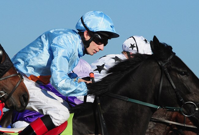 SUNBURY, ENGLAND - OCTOBER 11:  Luke Morris in action during the Bet Euro 2012 Football - Betdaq Claiming Stakes race at Kempton Park on October 11, 2010 in Sunbury, England.  (Photo by Mike Hewitt/Getty Images)