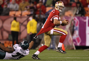 SAN FRANCISCO - OCTOBER 10:  Alex Smith #11 of the San Francisco 49ers is tackled by Juqua Parker #75 of the Philadelphia Eagles during an NFL game at Candlestick Park on October 10, 2010 in San Francisco, California.  (Photo by Jed Jacobsohn/Getty Images)