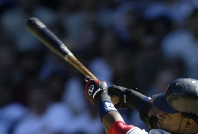 SEATTLE - AUGUST 27:  David Ortiz #34 of the Boston Red Sox hits a solo home run in the sixth inning against the Seattle Mariners August 27, 2006 at Safeco Field in Seattle, Washington. The hit was the first in the game for the Red Sox.  (Photo by Otto Greule Jr/Getty Images)