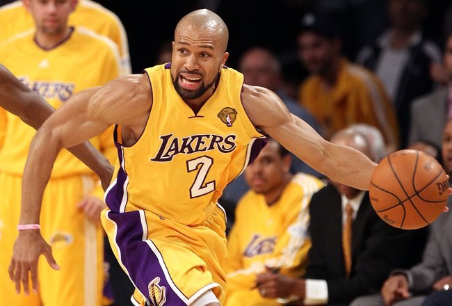 LOS ANGELES, CA - JUNE 17:  Derek Fisher #2 of the Los Angeles Lakers moves the ball in Game Seven of the 2010 NBA Finals against the Boston Celtics at Staples Center on June 17, 2010 in Los Angeles, California.  NOTE TO USER: User expressly acknowledges and agrees that, by downloading and/or using this Photograph, user is consenting to the terms and conditions of the Getty Images License Agreement.  (Photo by Christian Petersen/Getty Images)