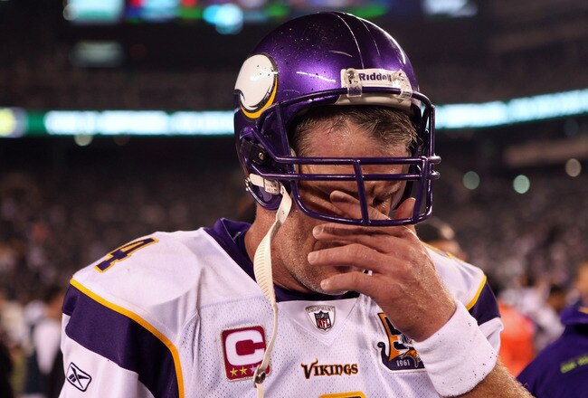 EAST RUTHERFORD, NJ - OCTOBER 11:  Brett Favre #4 of the Minnesota Vikings wipes his eyes as he walks off the field after the New York Jets won 29-20 at New Meadowlands Stadium on October 11, 2010 in East Rutherford, New Jersey.  (Photo by Andrew Burton/Getty Images)