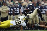 SOUTH BEND, IN - SEPTEMBER 11: Cierre Wood #20 of the Notre Dame Fighting Irish is tackled by Jordan Kovacs #32 of the Michigan Wolverines at Notre Dame Stadium on September 11, 2010 in South Bend, Indiana. Michigan defeated Notre Dame 28-24. (Photo by Jonathan Daniel/Getty Images)